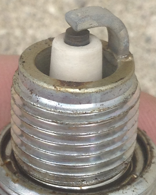 These photos are of the same plug after 10 minute WOT, just flipsides of the same plug. After seeing this I decided to play it safe and return the jet needle clip to the middle instead of top.