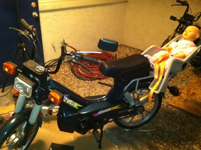 It looks funnier when you see it bombing down the road . I know people will be calling the cops  ....aaaah some guy on a scooter has a baby on the back .....