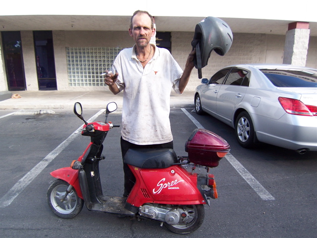 I was driving through a parking lot  and saw this guy driving his scoot and  said hey you want to sell that ?