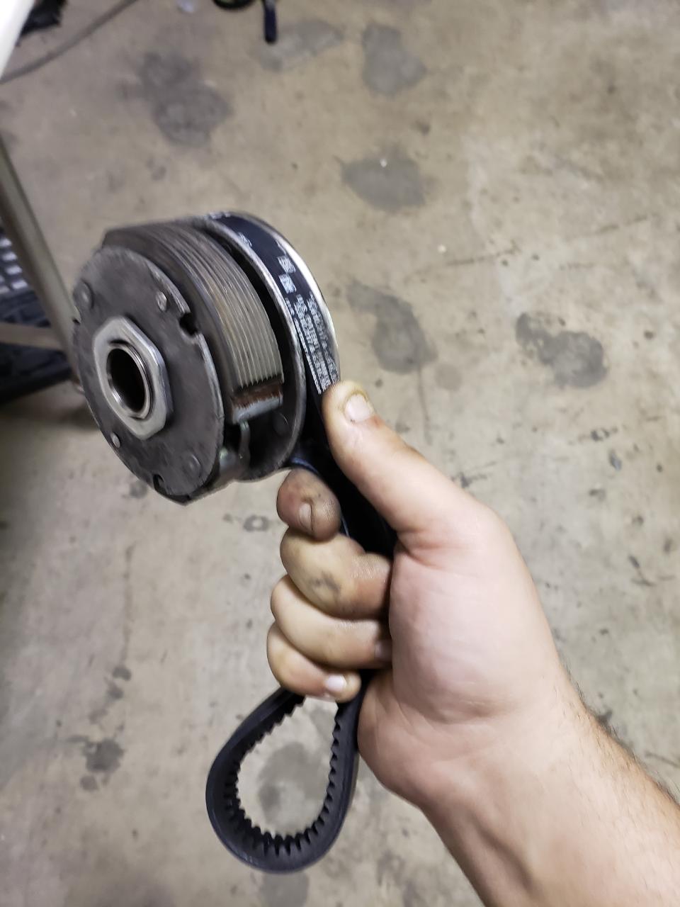 Had to force the spring open to seat the belt in the pulley and clear the rear case tab.