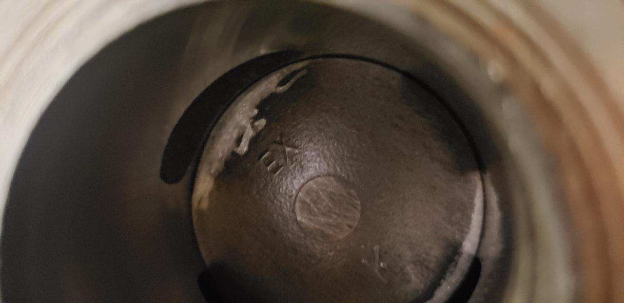 Piston is always in the way of incoming flow and as the piston comes up it abruptly cuts off flow. A 45-50 degree slant at the crown would open the port sooner and taper of the flow of air/fuel rather than just cut it off.