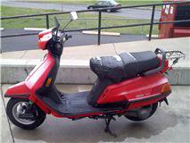 This is how I found her. Sun bleached chaulky pink, duct tape seat, busted mirrors, and a big hole in the exhaust.