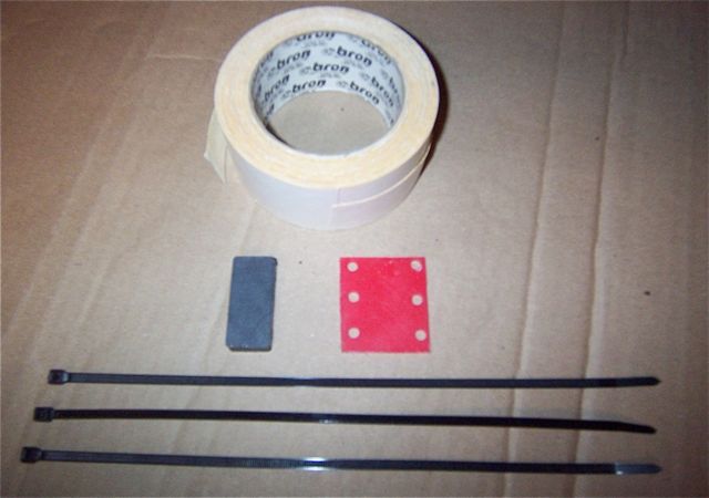 A magnet  / a hunk of plastic with some holes drilled in it / double sided tape / zip ties / DONE !